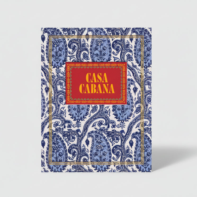 Casa Cabana book with blue paisley pattern, gold border, and red title box.