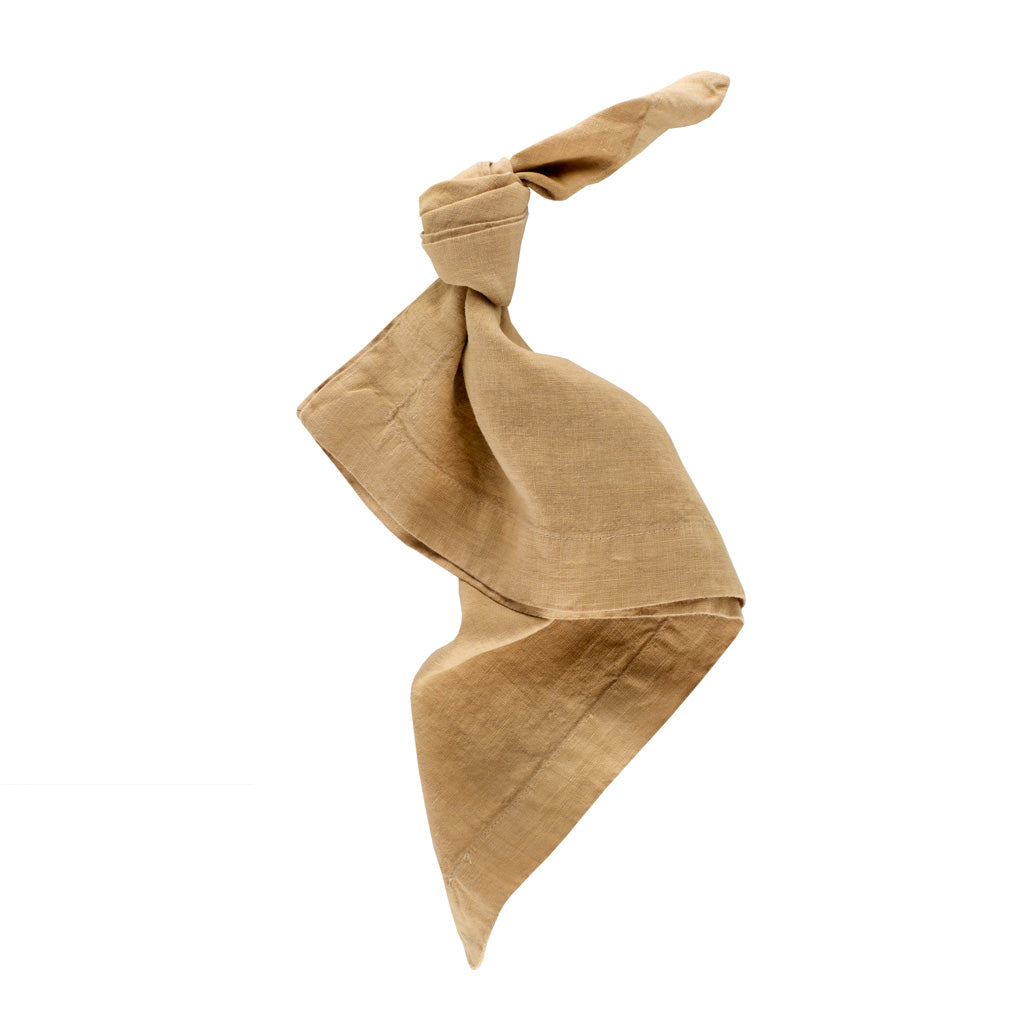 Chai HG Signature hand-dyed linen napkin, 22-inch square, tied in a knot.