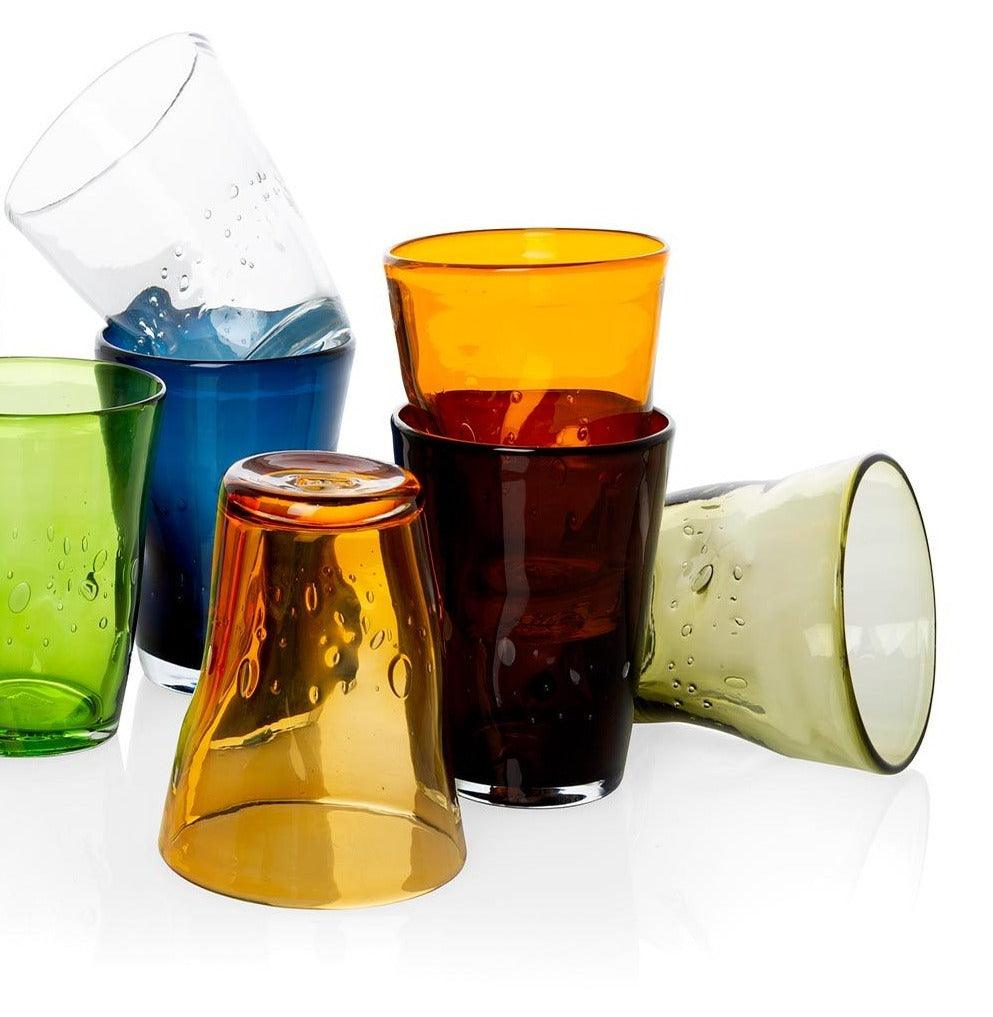Clear Henri Glass, 8 oz. Mouth-blown glassware in various vibrant colors with unique imperfections and air bubbles.