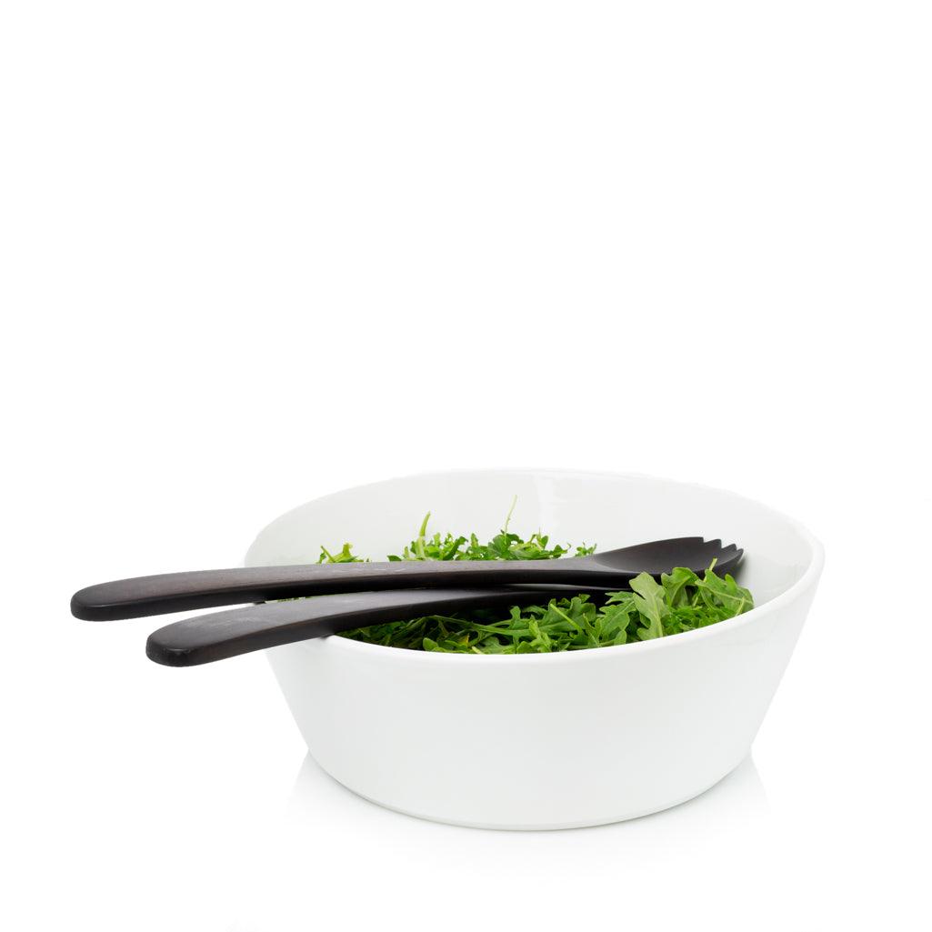 Corno Ceramic Serve Bowl, creamy white earthenware, 12.5" Dia, with dark wood salad servers and greens.