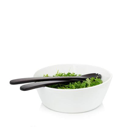 Corno Ceramic Serve Bowl, creamy white earthenware, 12.5" Dia, with dark wood salad servers and greens.