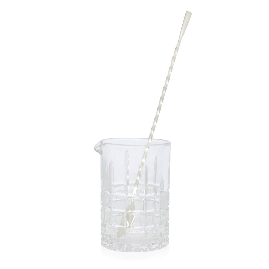 Clear square-cut crystal cocktail mixing glass with pour spout and silverplate long bar stirrer.