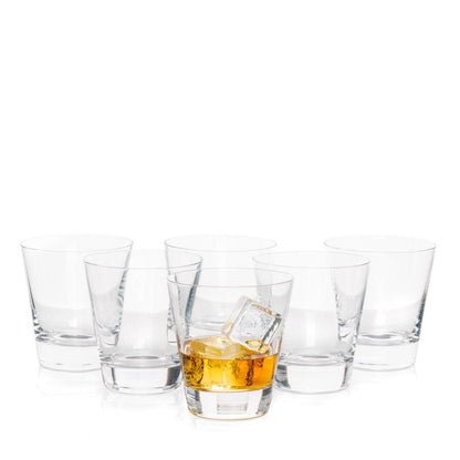 Set of 6 clear crystal whiskey glasses, one with amber liquid and ice, on a white background.