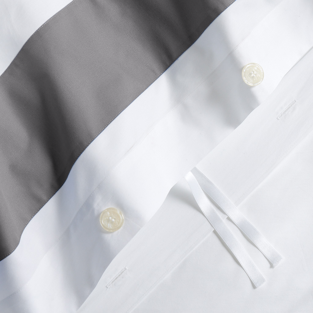 Dark Grey Wide-Band Percale Duvet Cover with white fabric, buttons, and ties.