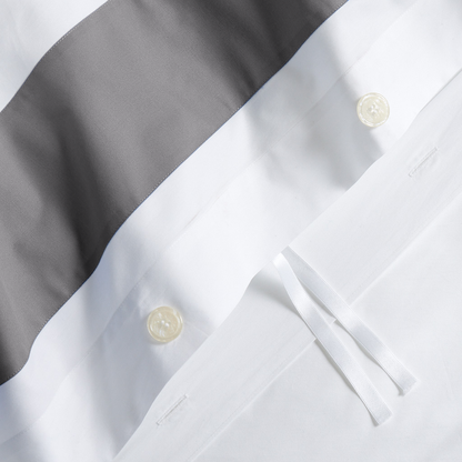 Dark Grey Wide-Band Percale Duvet Cover with white fabric, buttons, and ties.