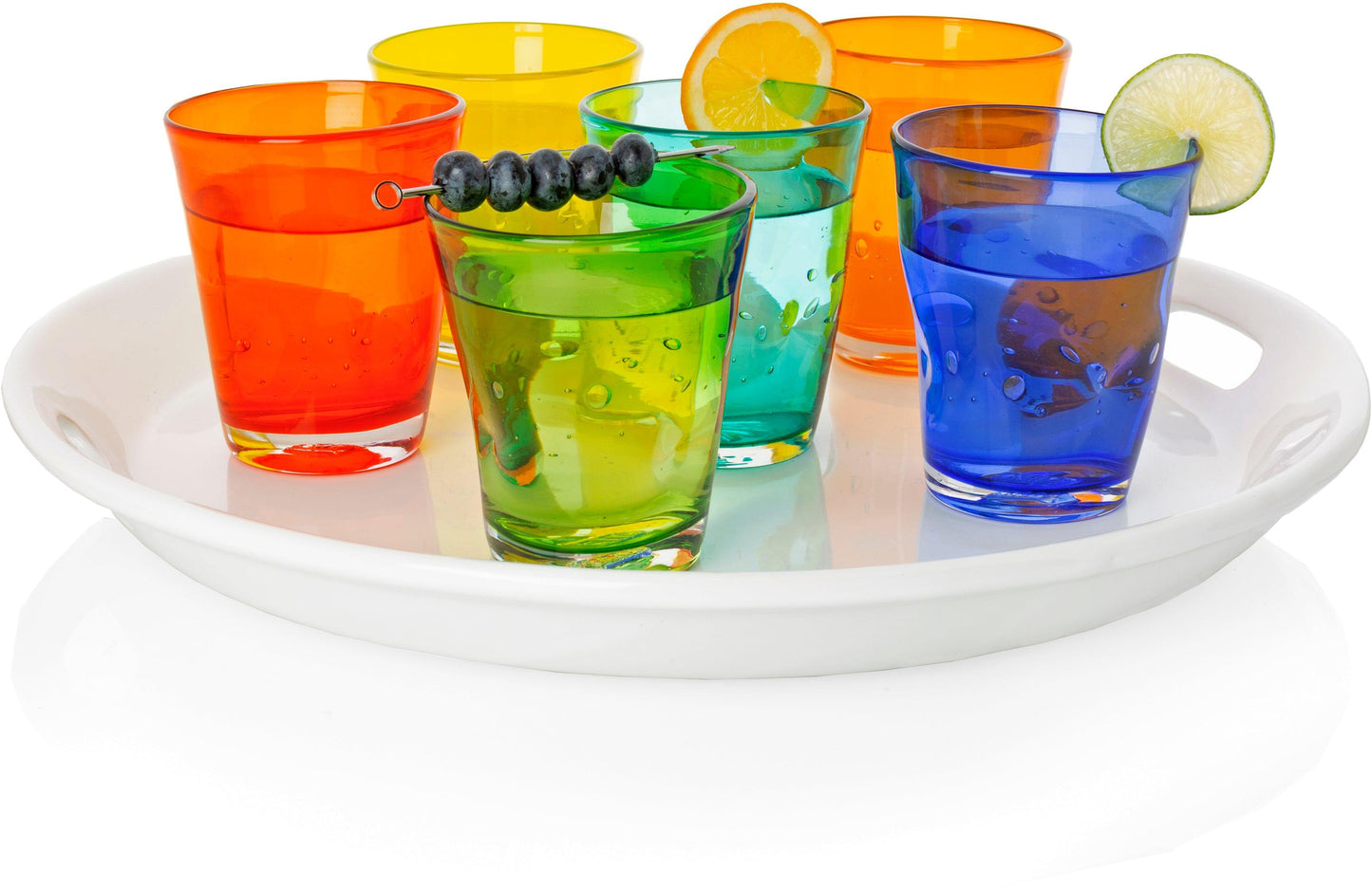 Assorted Henri mouth-blown glassware in dark orange, yellow, green, teal, and blue, on a white tray.
