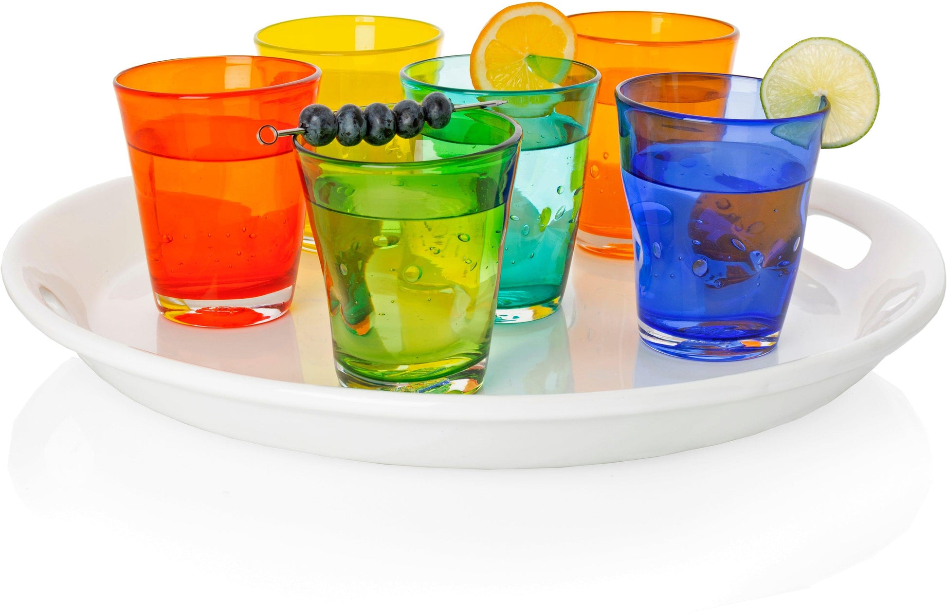 Assorted Henri mouth-blown glassware in dark orange, yellow, green, teal, and blue, on a white tray.