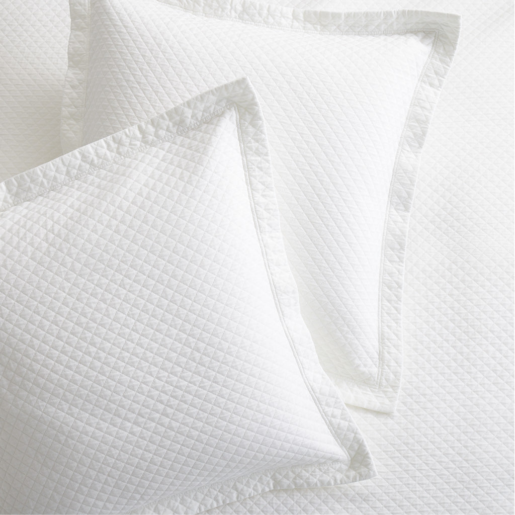 Diamond White Cotton Matelassé Pillow Shams, set of 2, with subtle diamond pattern and tailored edges.