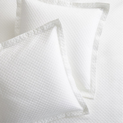 Diamond White Cotton Matelassé Pillow Shams, set of 2, with subtle diamond pattern and tailored edges.