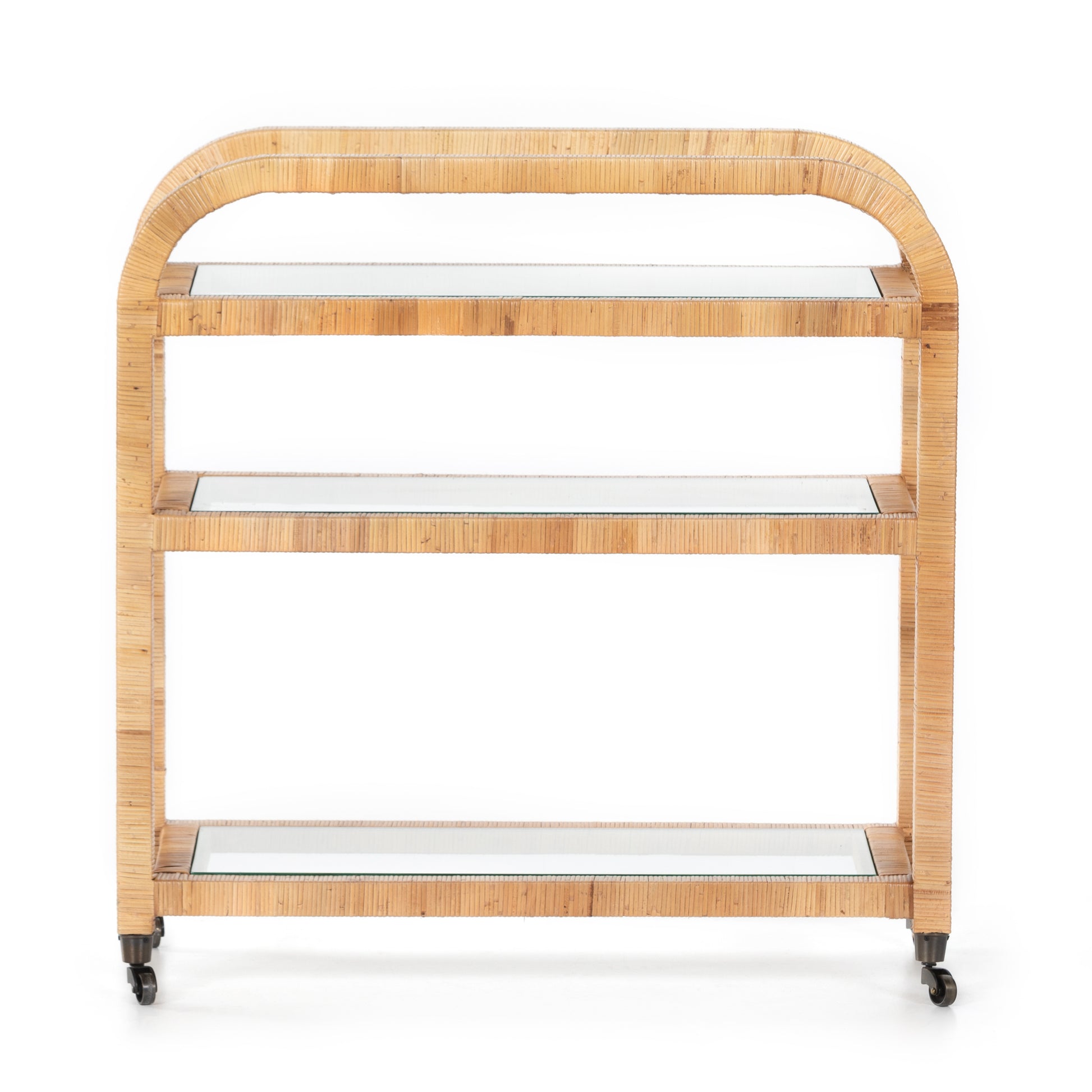 Dory Rattan Bar Cart with honey-finished rattan frame, three glass tiers, and wheels.
