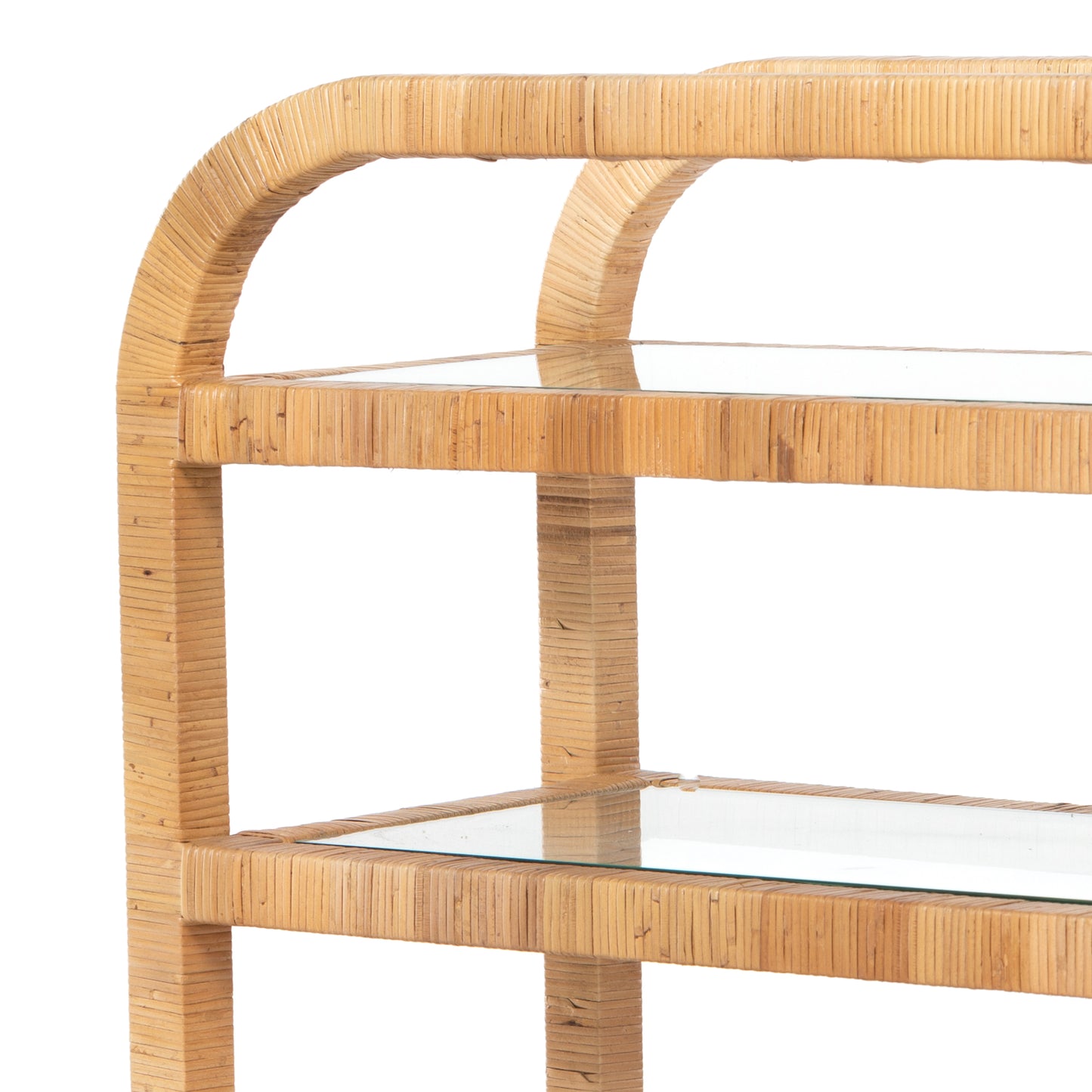 Dory Rattan Bar Cart, honey-finished rattan, three clear glass tiers, curved top handle.