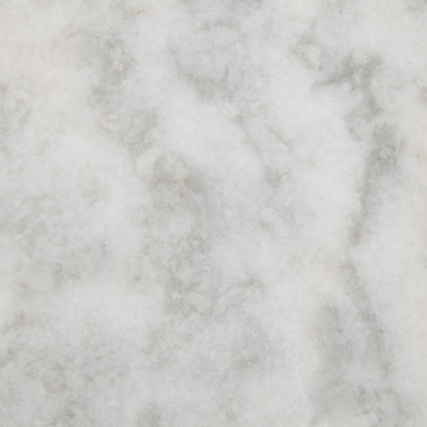 White marble with subtle grey veining, a close-up texture.