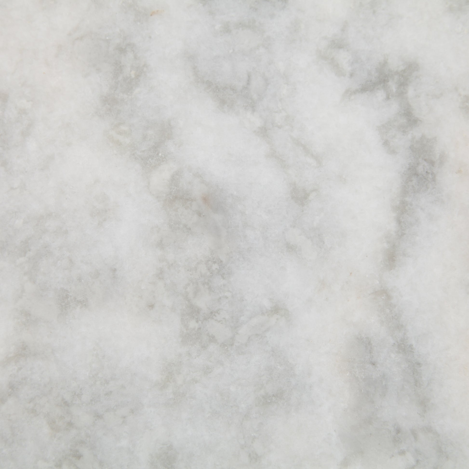 White marble with subtle grey veining, a close-up texture.
