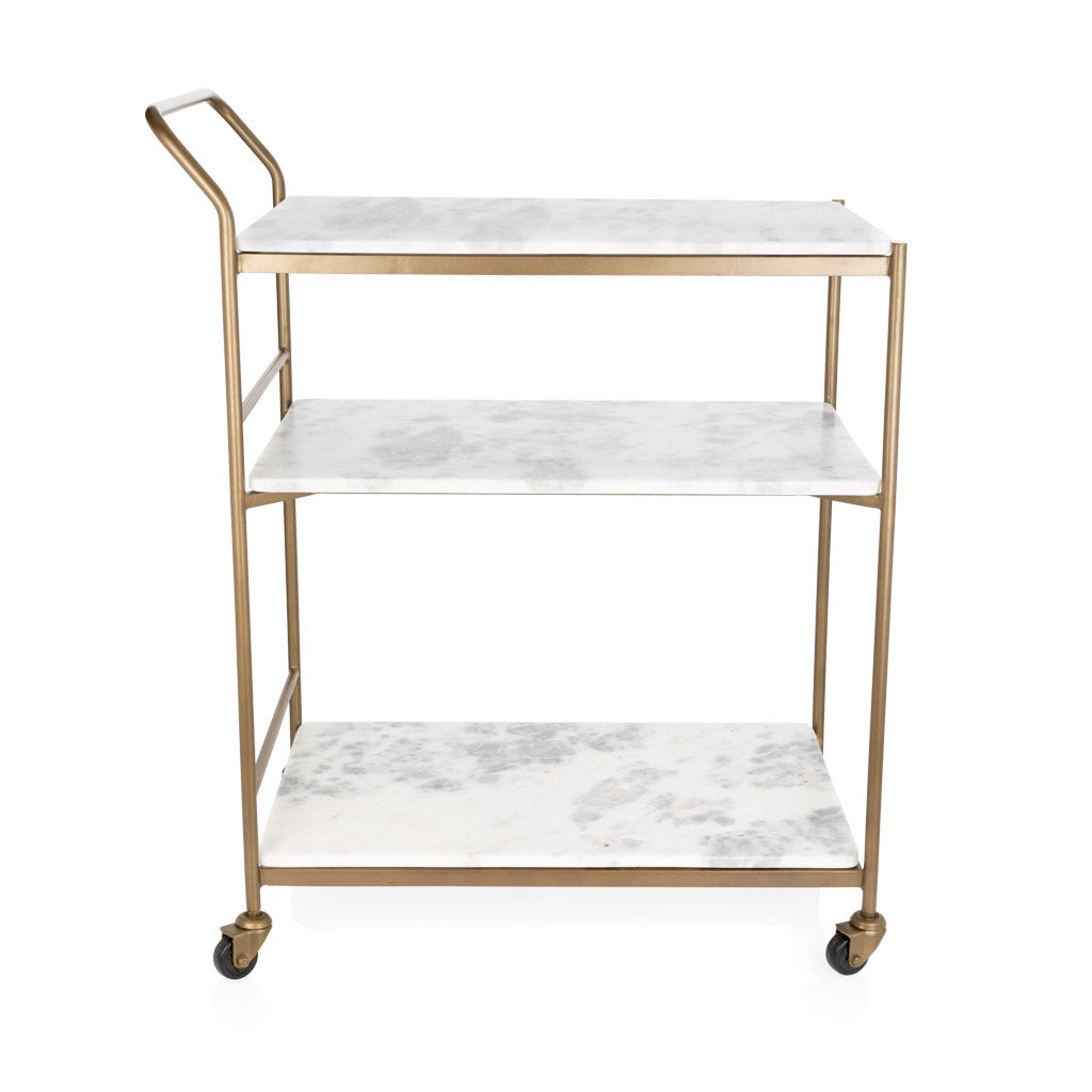 Felix antique brass bar cart with three rectangular white marble shelves and casters.
