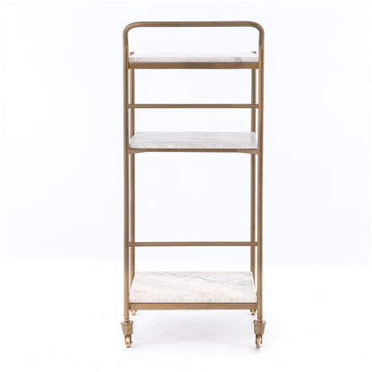 Felix antique brass bar cart with three white marble square shelves and casters.