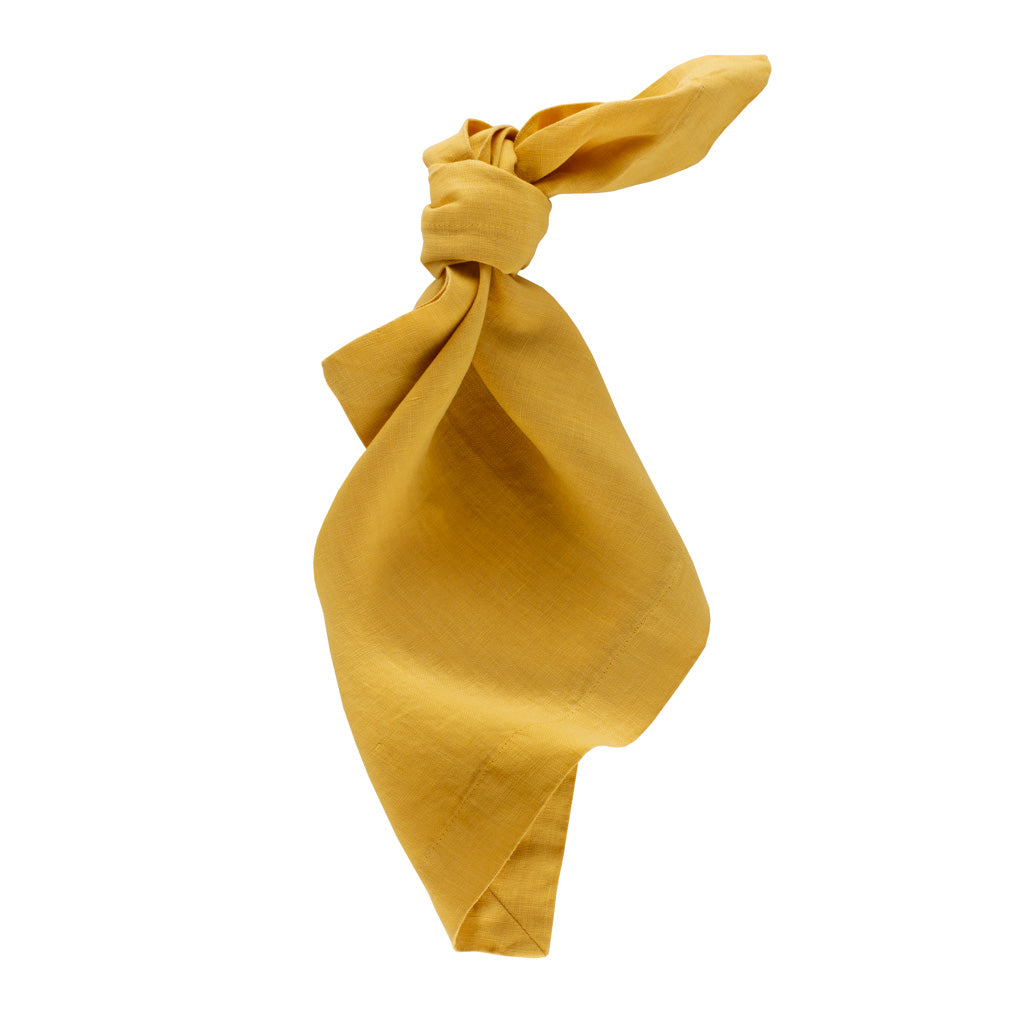 Golden Mustard HG Signature hand-dyed 22-inch linen napkin, tied in a knot.