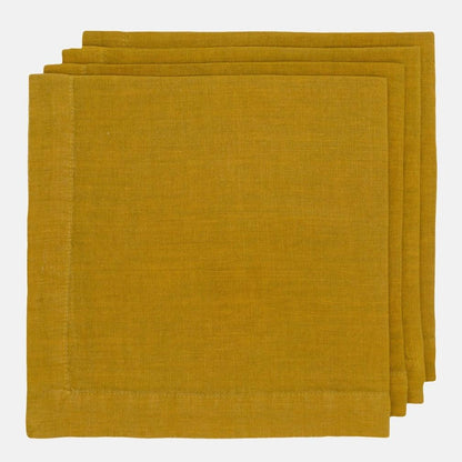Goldenrod HG Signature hand-dyed linen napkins, 22-inch square, folded with mitered corners.