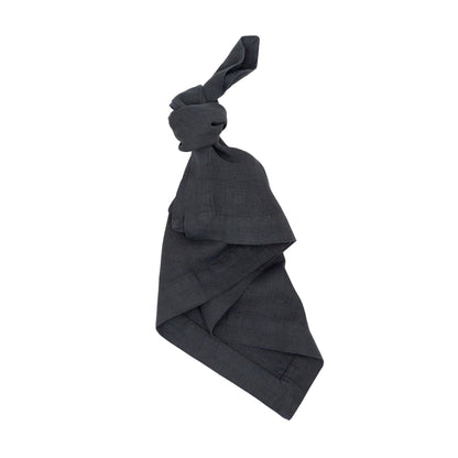 Graphite HG Signature hand-dyed linen napkin, 22" square, tied in a knot.