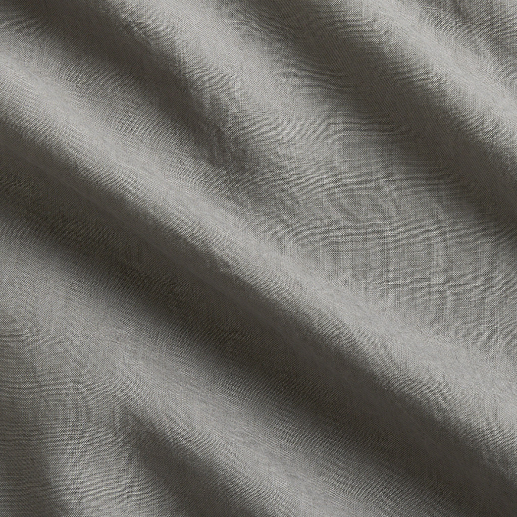 Grey Washed-Linen Pillow Sham fabric swatch with subtle wrinkles and texture.