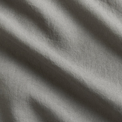 Grey Washed-Linen Pillow Sham fabric swatch with subtle wrinkles and texture.