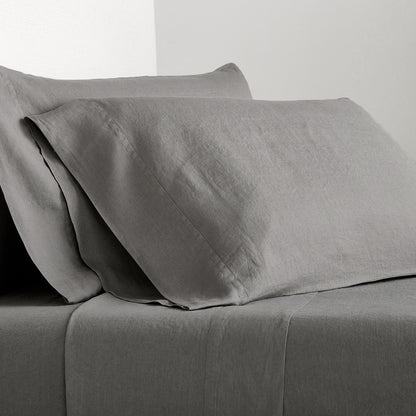 Grey Washed-Linen Sheet Set with two pillowcases and a fitted sheet, showing the fabric's texture.