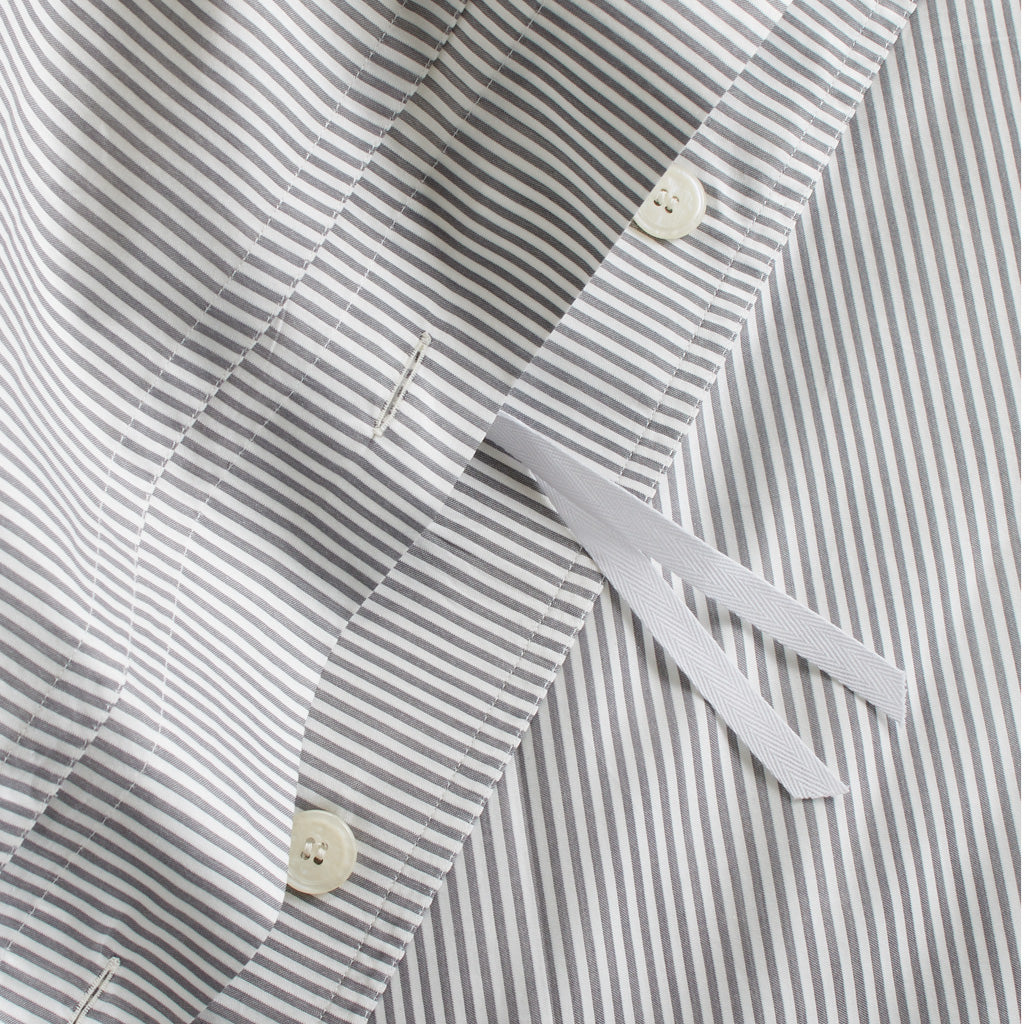 Grey Stripe Cotton-Chambray Duvet Cover with hidden button closure, corner ties, and thin stripes.