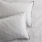 Set of 2 grey stripe cotton-chambray pillow shams with thin stripes and a 2” flange.
