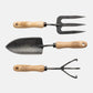 3-piece hand-forged steel garden tool set with ash hardwood handles: trowel, fork, and 3-tine cultivator.