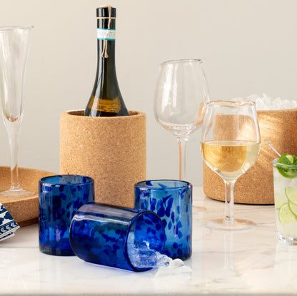 Handmade 12oz blue tortoise double old-fashioned glasses, mouth-blown glass, with ice.