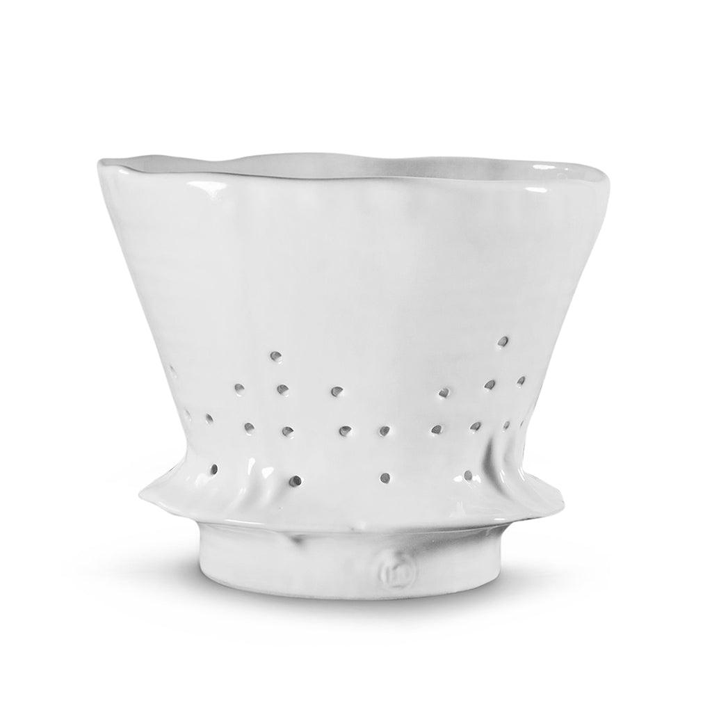 Handmade creamy white ceramic colander by Montes Doggett, 9.5"Dia x 7.5"H, with wavy rim and drain holes.