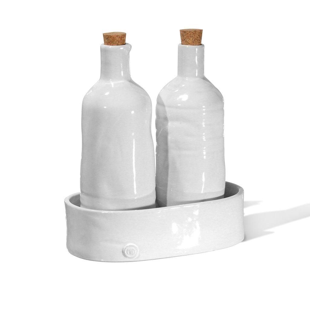 Handmade creamy white ceramic oil and vinegar cruets with corks in a matching tray by Montes Doggett.