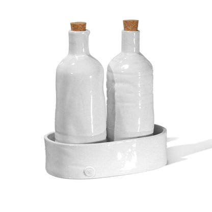 Handmade creamy white ceramic oil and vinegar cruets with corks in a matching tray by Montes Doggett.
