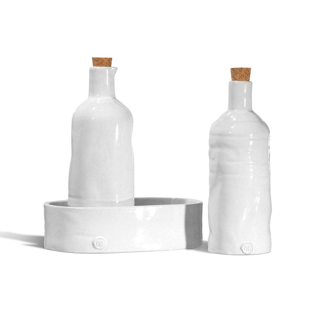 Handmade creamy white ceramic oil and vinegar cruets with corks, on a matching tray. Montes Doggett design.