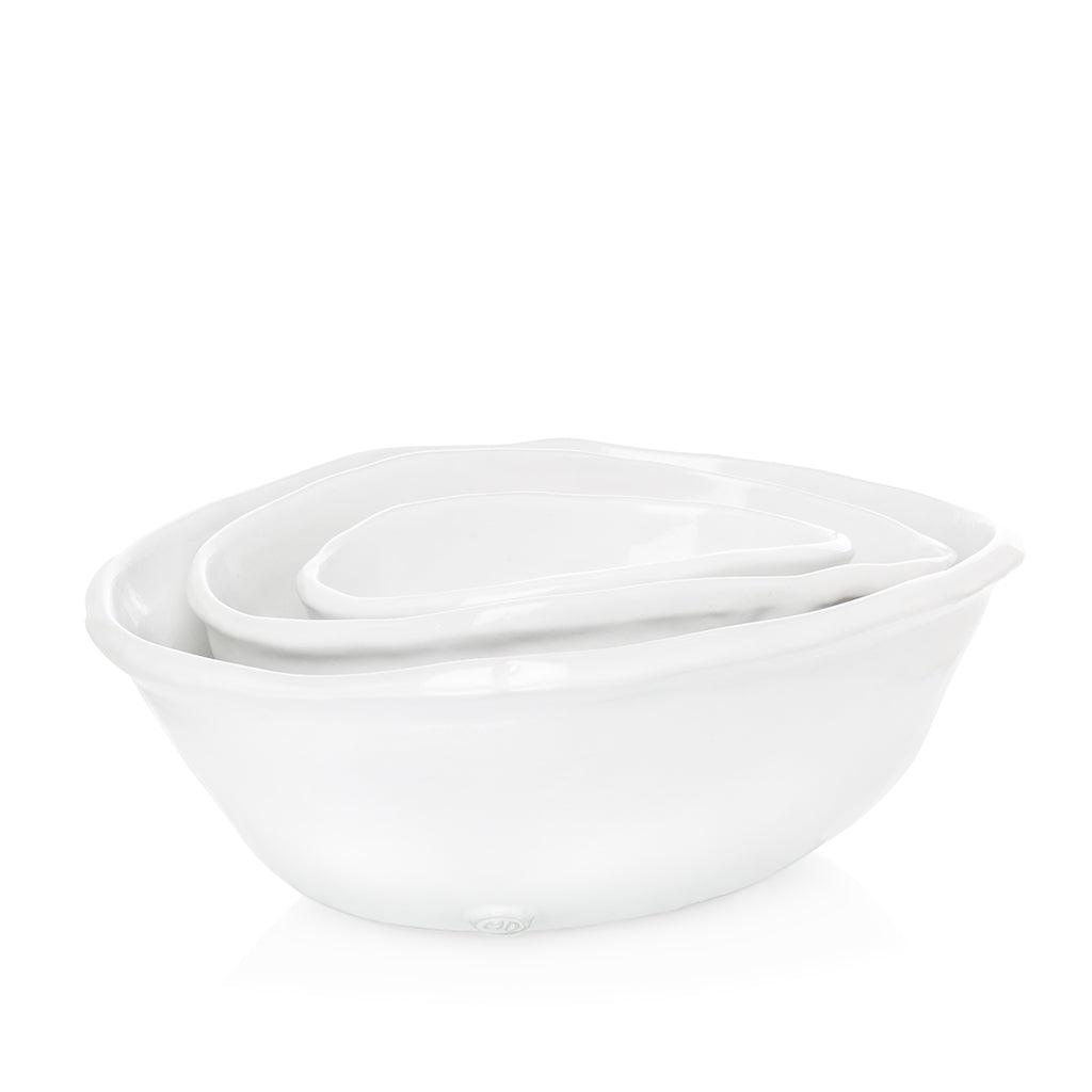 Set of 3 Montes Doggett handmade white ceramic oval bowls, nested.