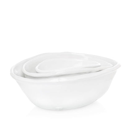 Set of 3 Montes Doggett handmade white ceramic oval bowls, nested.