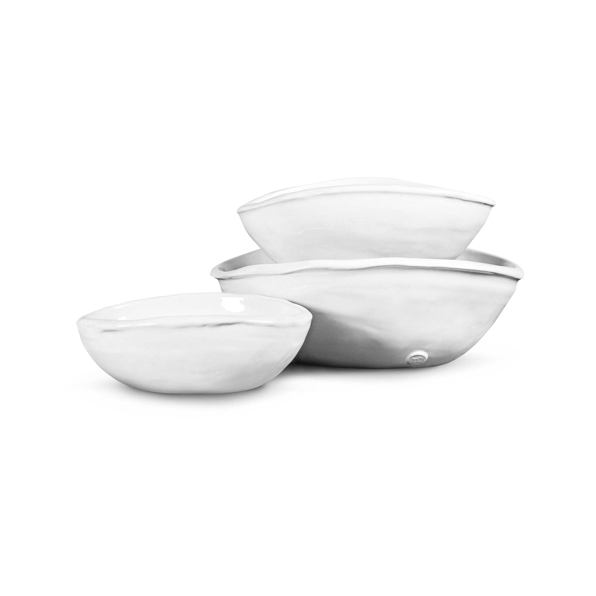 Montes Doggett set of 3 handmade white ceramic oval bowls with organic shapes.