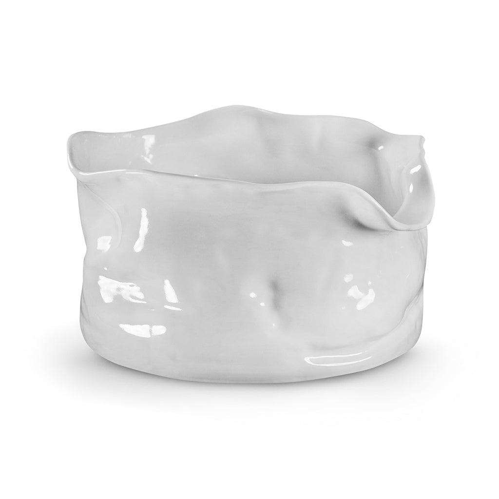 Handmade white ceramic serve bowl by Montes Doggett, with organic, wavy rim and textured sides.