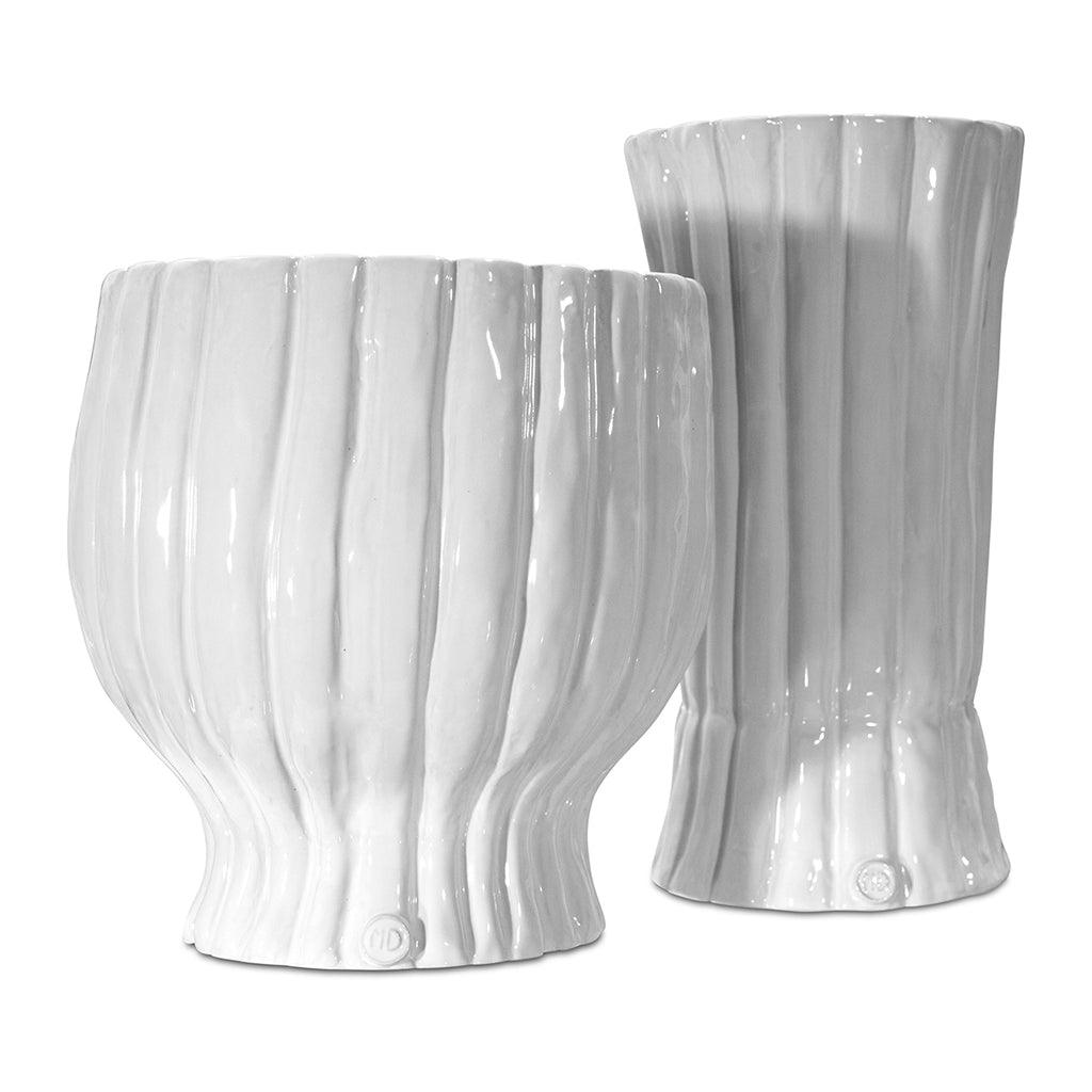 Two handmade Montes Doggett ceramic vases, creamy white glaze, ribbed texture.