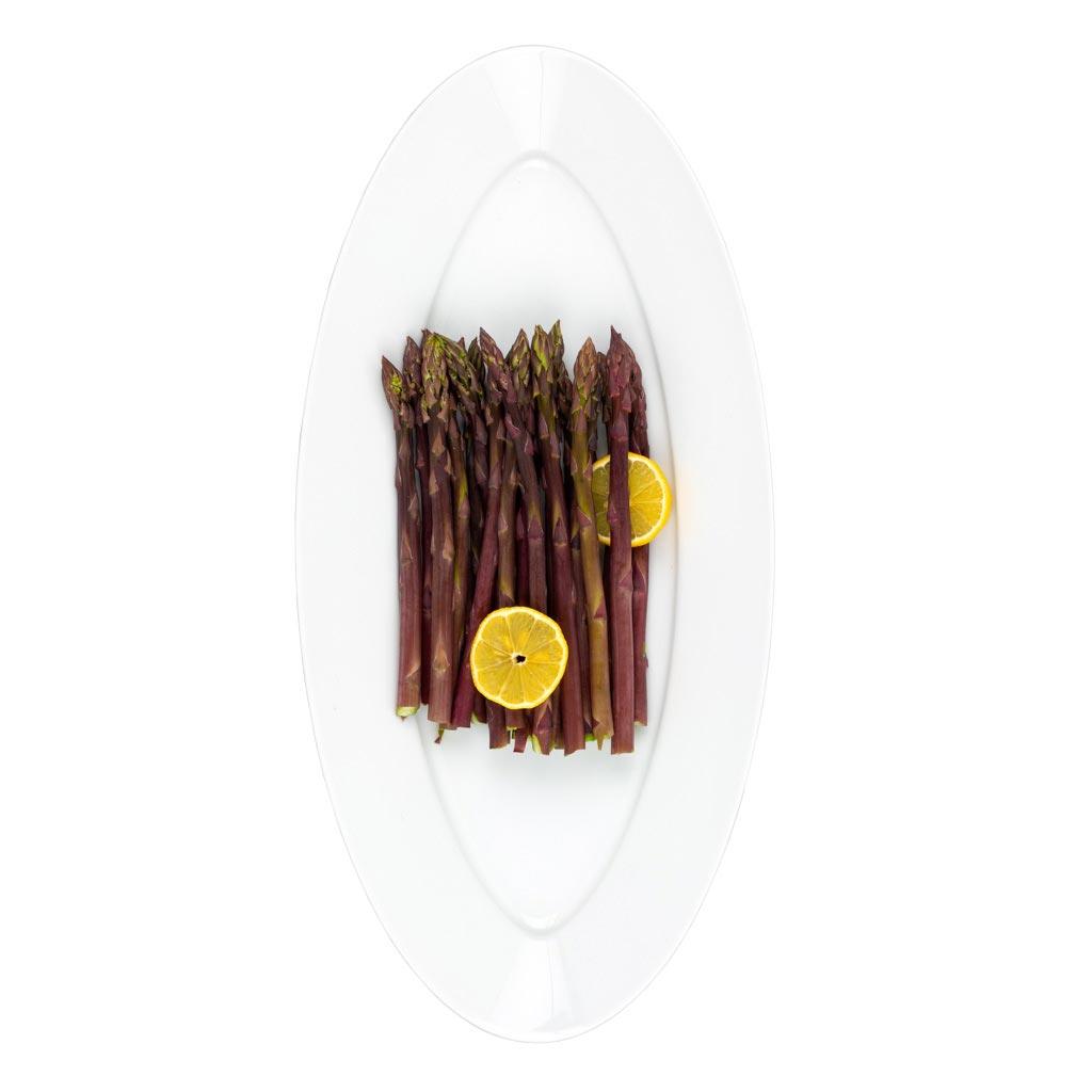 White HG Classic Porcelain Oval Serving Platter with purple asparagus and lemon slices.
