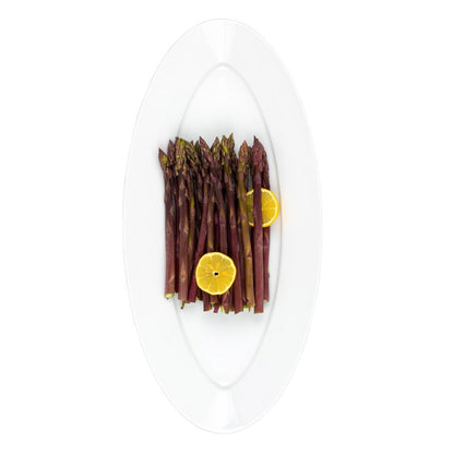 White HG Classic Porcelain Oval Serving Platter with purple asparagus and lemon slices.