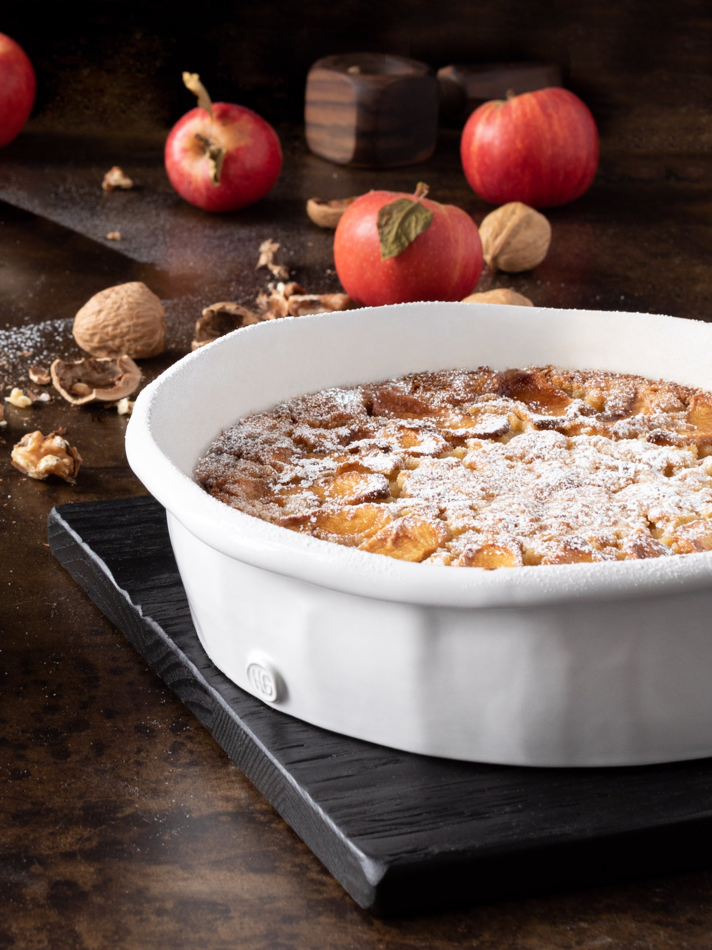 HG Handmade Ceramic Round Baking Dish by Montes Doggett, creamy white, filled with a baked dessert.