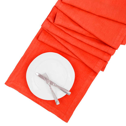 International Orange HG Signature hand-dyed linen table runner with white plate and silverware.