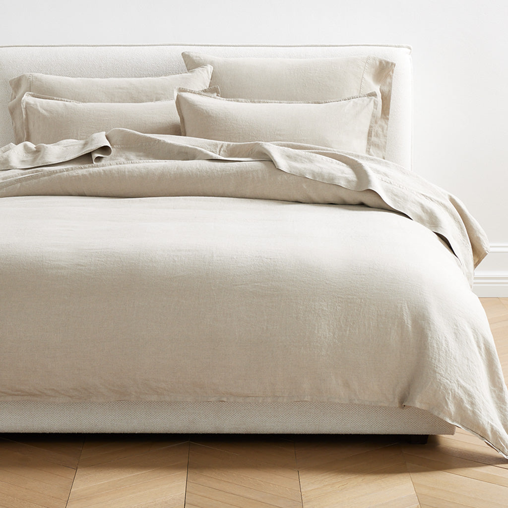 Khaki Washed-Linen Duvet Cover and shams on a bed, showing the relaxed texture and neutral color.