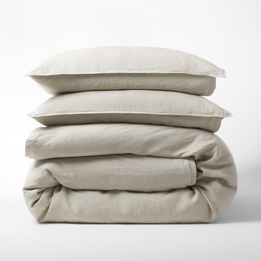 Khaki Washed-Linen Duvet Cover set, folded with two shams, showcasing the medium-weight Italian flax linen.