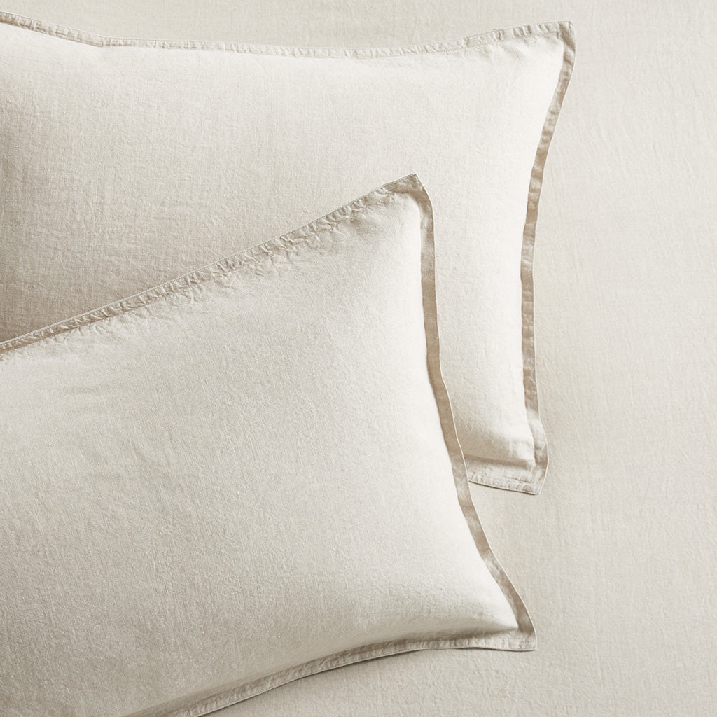 Set of 2 khaki washed-linen pillow shams with 2" flange and double-needle stitching.
