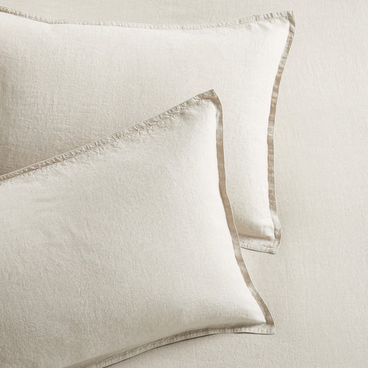 Set of 2 khaki washed-linen pillow shams with 2" flange and double-needle stitching.