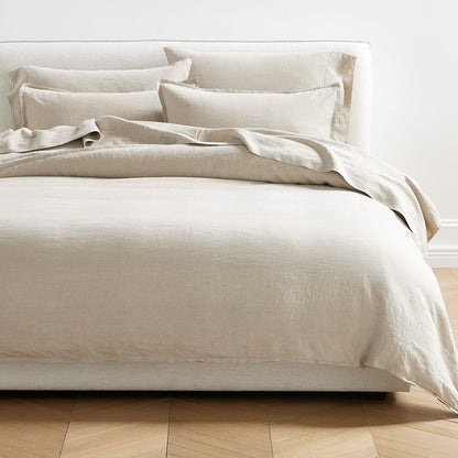Khaki Washed-Linen Pillowcases and bedding set on a bed, showing soft texture and relaxed style.