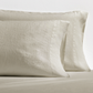 Set of 2 khaki washed-linen pillowcases with subtle texture and double-needle stitching.