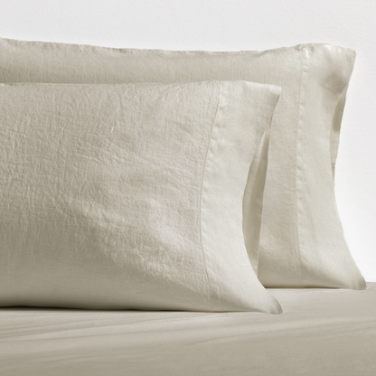 Set of 2 khaki washed-linen pillowcases with subtle texture and double-needle stitching.