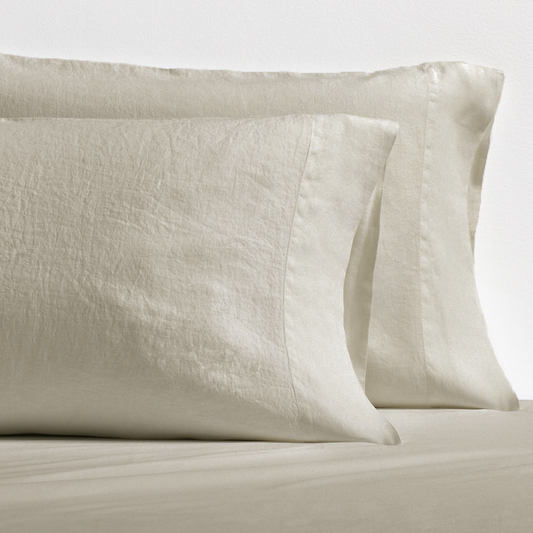 Set of 2 khaki washed-linen pillowcases with subtle texture and double-needle stitching.